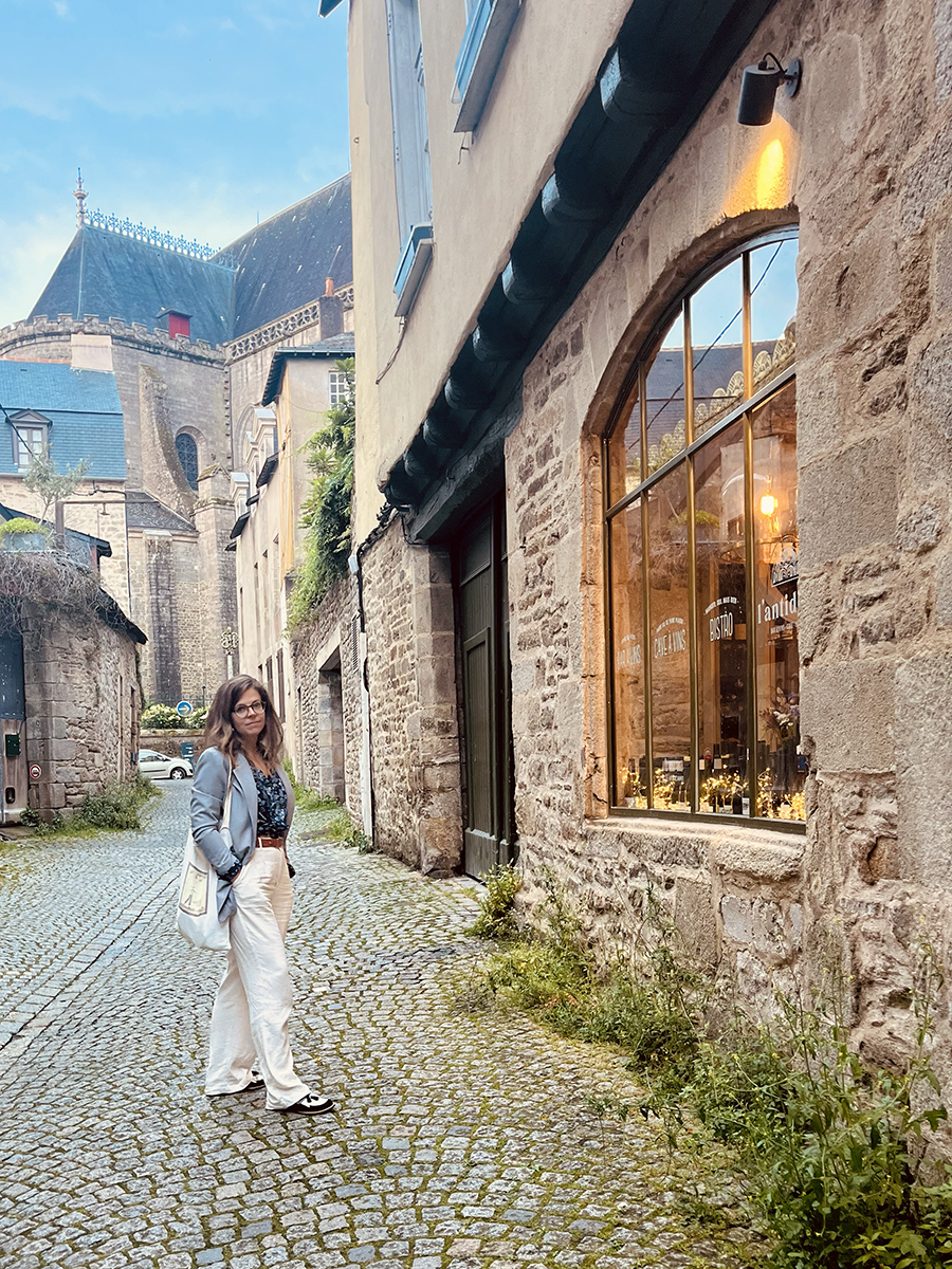 Woman standing in the cobblestone streets of Vannes, Brittany – capturing the charm of French historic towns and soulful travel moments