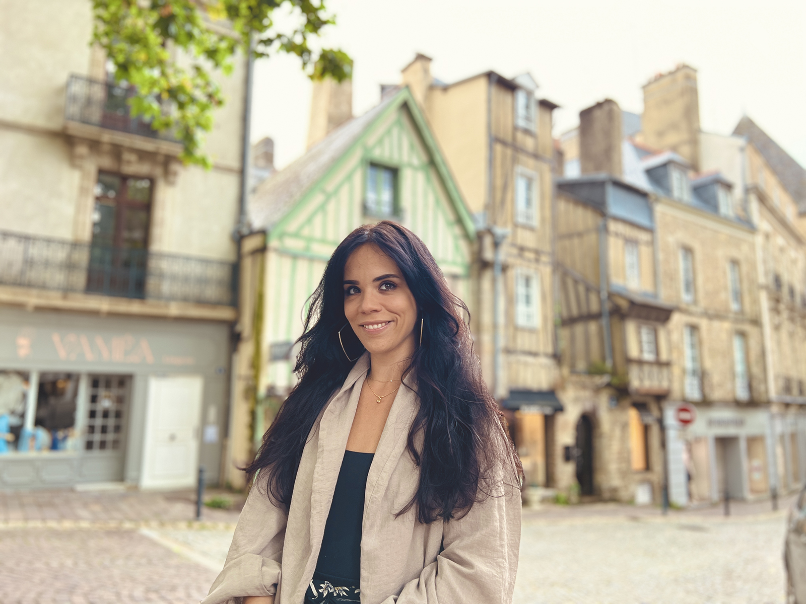 Woman standing in the cobblestone streets of Vannes, Brittany – capturing the charm of French historic towns and soulful travel moments